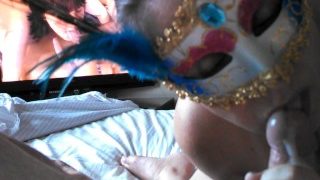 Masked wife sucks hubby and fingers his asshole while he watches gay porn