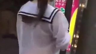 Japanese exhibitionist with butt out in streets