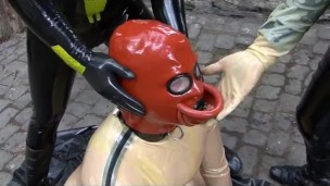 Latex Couple With Rubber In Transparent Catsuit Drinking Femdom Piss